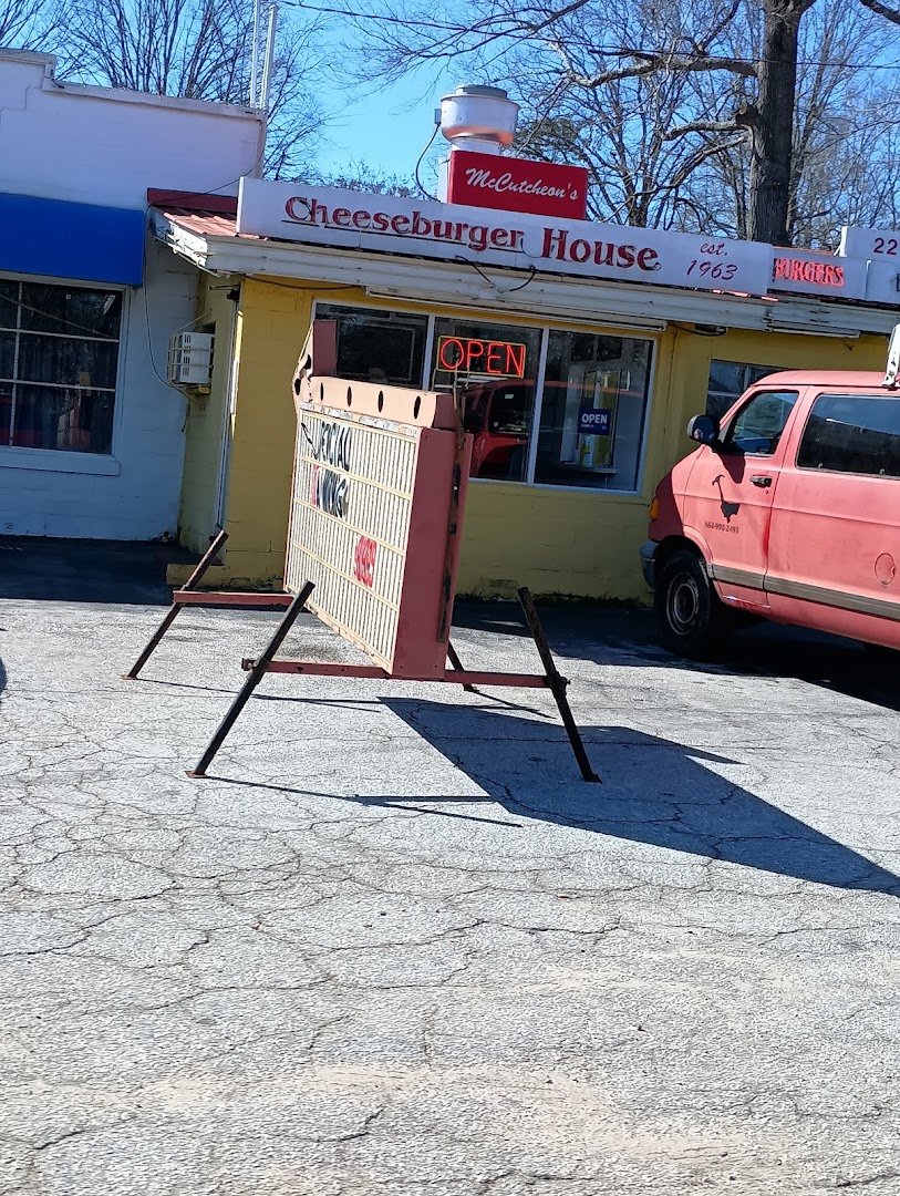 Cheeseburger House storefront and roadside sign.